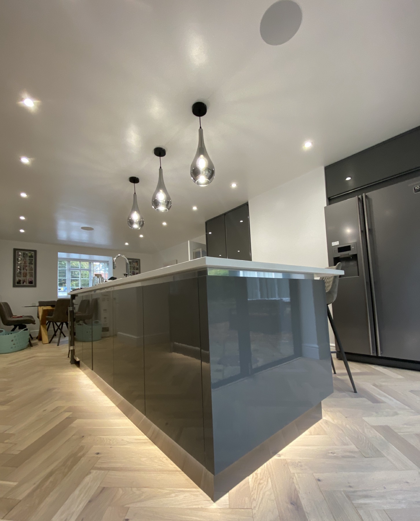 Kitchen island pendant lights and LED downlights installed by Huenique Electrical